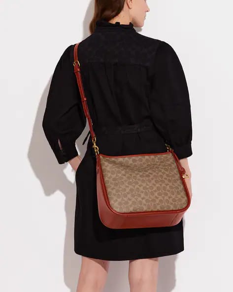 COACH Coated Canvas Signature Cary Crossbody Tan Rust